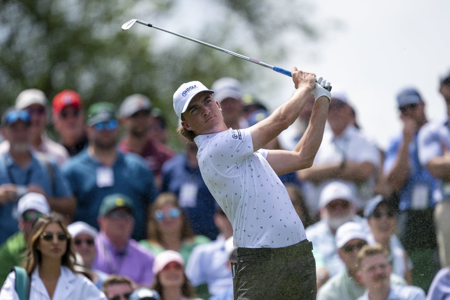 Jasper Stubbs of Australia plays a stroke from the No. 1 tee during the Par 3 Contest prior to the 2024 Masters Tournament