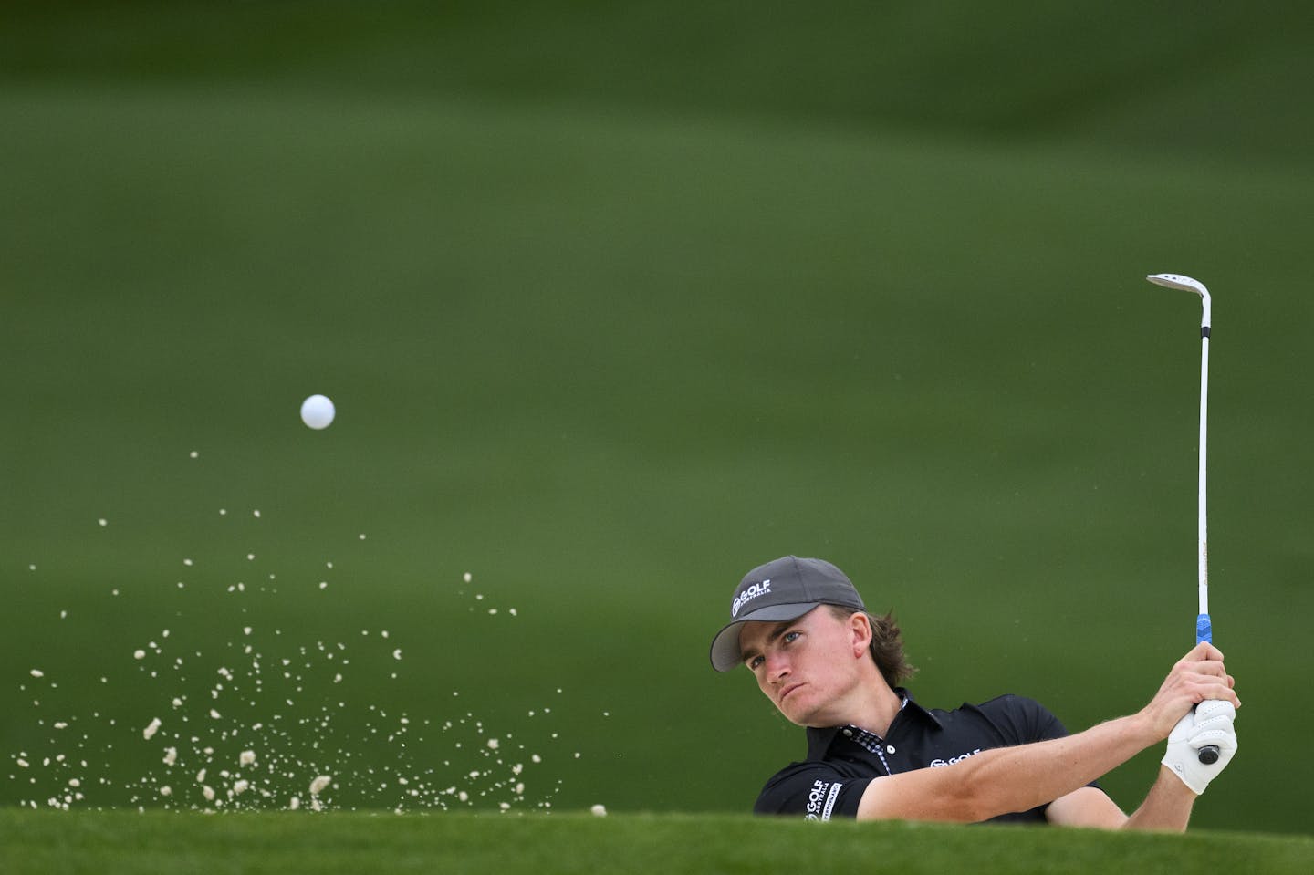 Jasper Stubbs of Australia plays a stroke from a bunker during practice round 2 prior to the start of the 2024 Masters Tournament